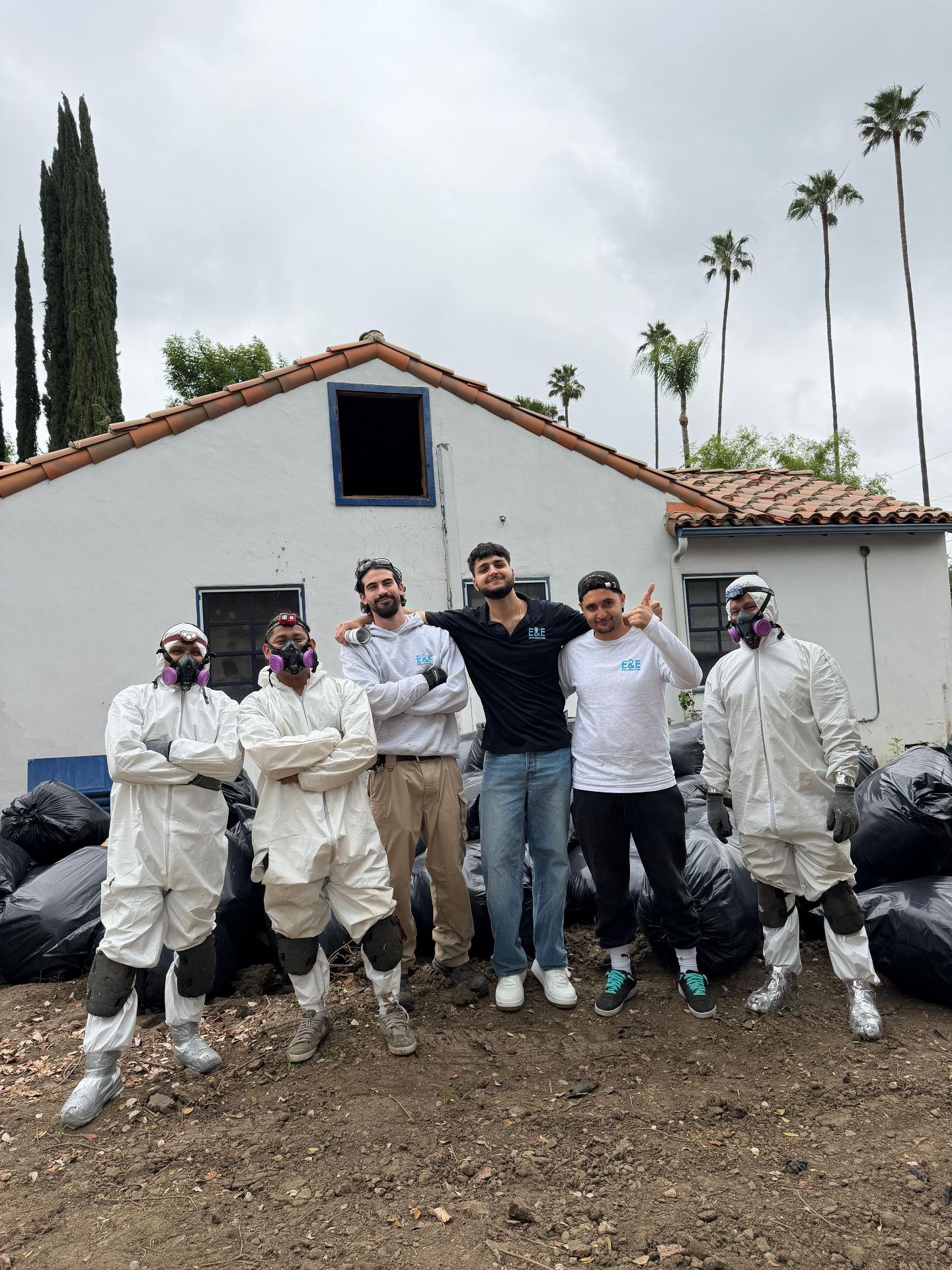 E&E Insulation crew after an attic clean-out job